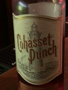 Cohasset Punch liquor bottle with lighthouse illustration, revived Chicago cocktail.