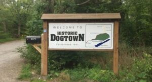Welcome to Historic Dogtown Massachusetts sign and landscape