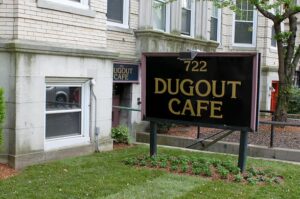 Exterior view of The Dugout Café in Boston, historic dive bar and social hub.