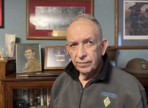 Anthony "Tony" Kurgan Jr., veteran, portrait with military decorations and family photos