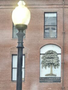 A bronze carving of the Liberty Tree adorns a building at the corner of Washington and Essex Streets in downtown Boston.