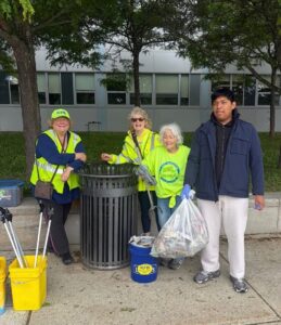 Marty Dutton and volunteers with Keep Framingham Beautiful collecting litter and recycling.