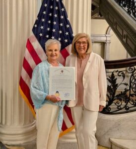 State Representative Kate Hogan, right, nominated Dr. Patricia Kelly Luoto for the Commonwealth Heroine Award for her work with the Hudson Community Food Pantry.