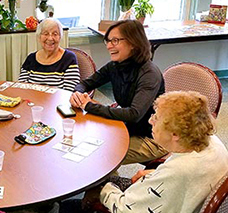Mass. Secretary of Elder Affairs Alice Bonner (right) speaks with residents during her visit to Dartmouth's Council on Aging to kick-off Older American's Month in May.