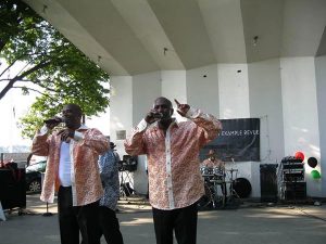 Lance (left) and Robert Williams perform on stage at the Salem, Mass. Willows Park