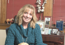 Joanne Peterson, the founder and executive director of Learn to Cope, with team member Kim Leman’s dog, Finn.