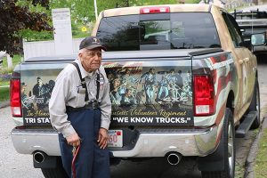 Pete DePina stands next to the truck that was a gift from his employer, Tri State Truck Center.