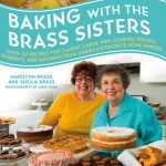 The cover of the sisters’ book, “Baking with the Brass Sisters”