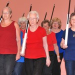 Peabody COA Senior Ladies Drill Team members practice with rifles made at the Peabody COA Woodworking Shop.