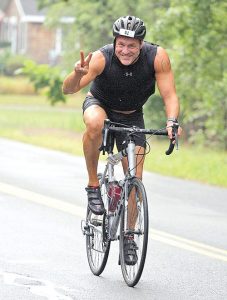 Larry Gamst bicycling in the 2017 Lakeville Cranberry Trifest