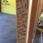 Volunteers’ signatures on a stud at the Ayer construction site