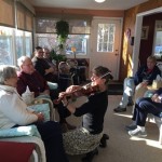 A violinist serenades café guests in Marlborough.