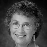 Janice Lindsay, Fifty Plus Advocate contributing writer, smiling and wearing glasses