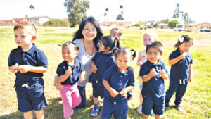 Anita Polich volunteering with 2 and 3 year olds in community daycare at the property of the orphanage